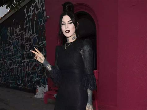 Kat Von D covers herself in black tattoo work after。